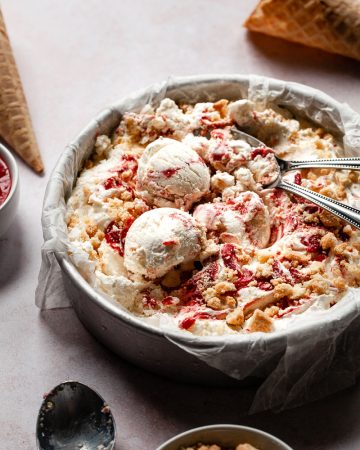 ice cream scoops in a round cake pan with cookie crumbs